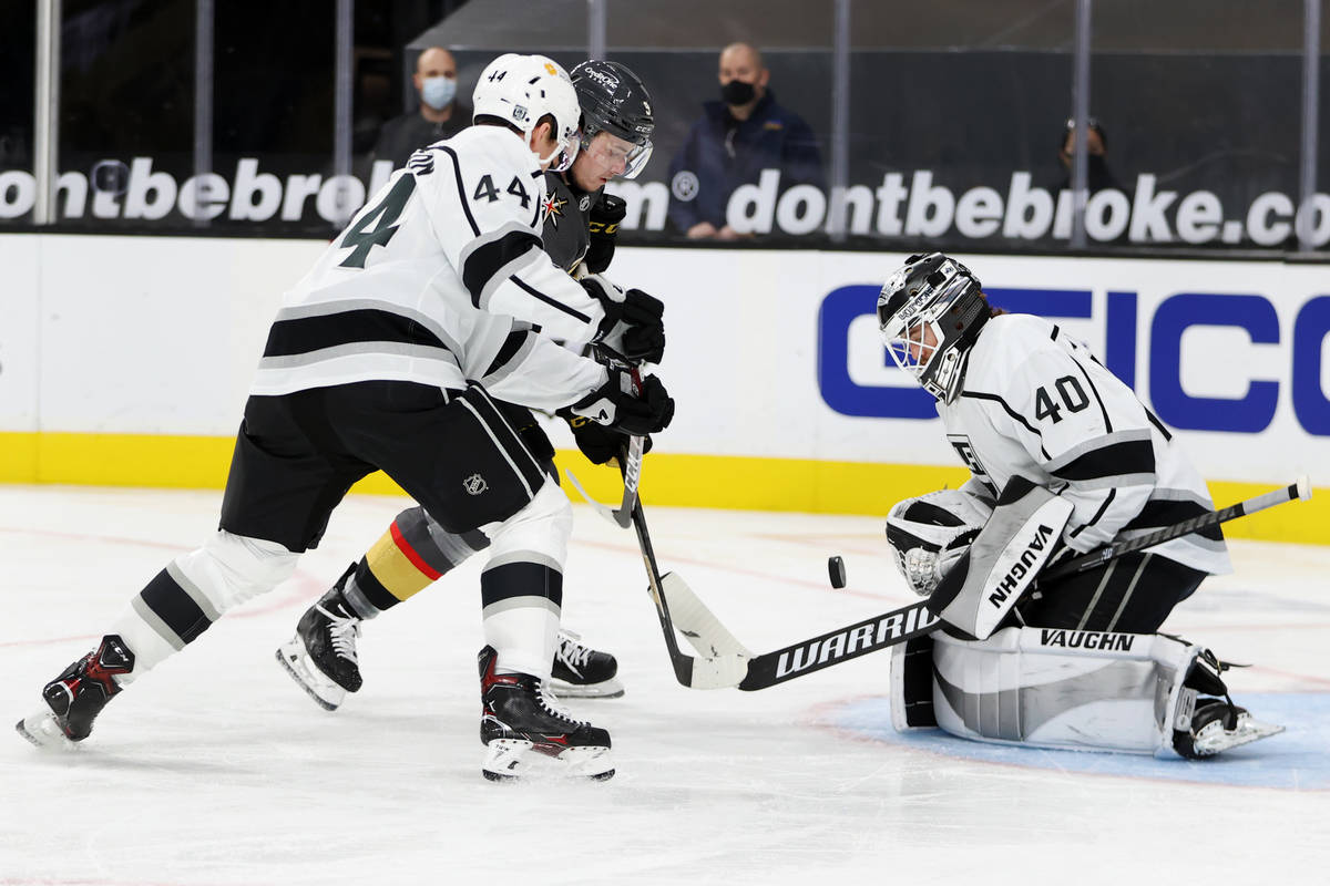 Vegas Golden Knights Cody Glass (9) fight for the puck under pressure from Los Angeles Kings de ...