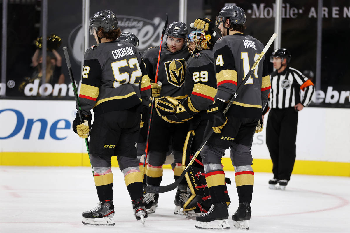 Vegas Golden Knights left wing William Carrier (28) embraces goaltender Marc-Andre Fleury (29) ...