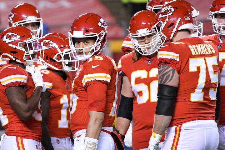 Kansas City Chiefs quarterback Patrick Mahomes looks to the sidelines during a break in play du ...