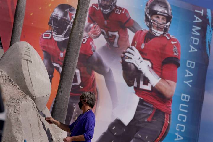 Dan Belcher sculpts the Lombardi Trophy out of sand outside Raymond James Stadium ahead of Supe ...