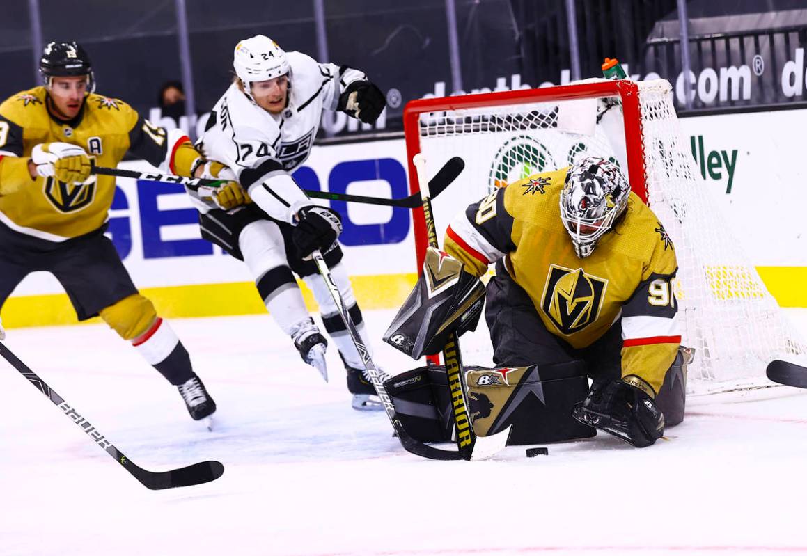 Golden Knights goaltender Robin Lehner (90) stops the puck against Los Angeles Kings center Lia ...