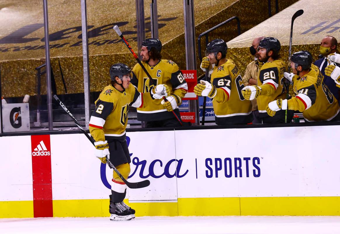 Golden Knights defenseman Zach Whitecloud (2) celebrates his goal during the first period of an ...