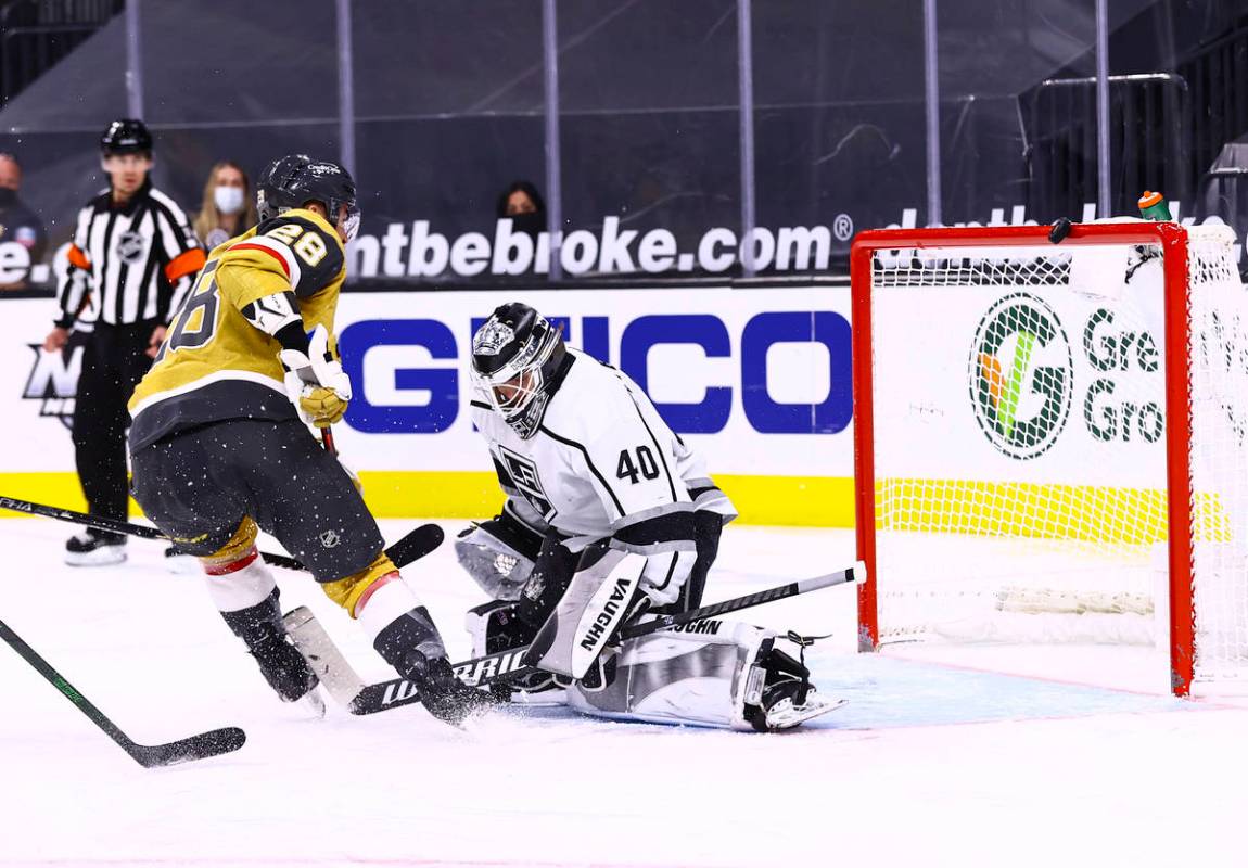 A shot by Golden Knights left wing William Carrier (28) bounces off the crossbar after being de ...