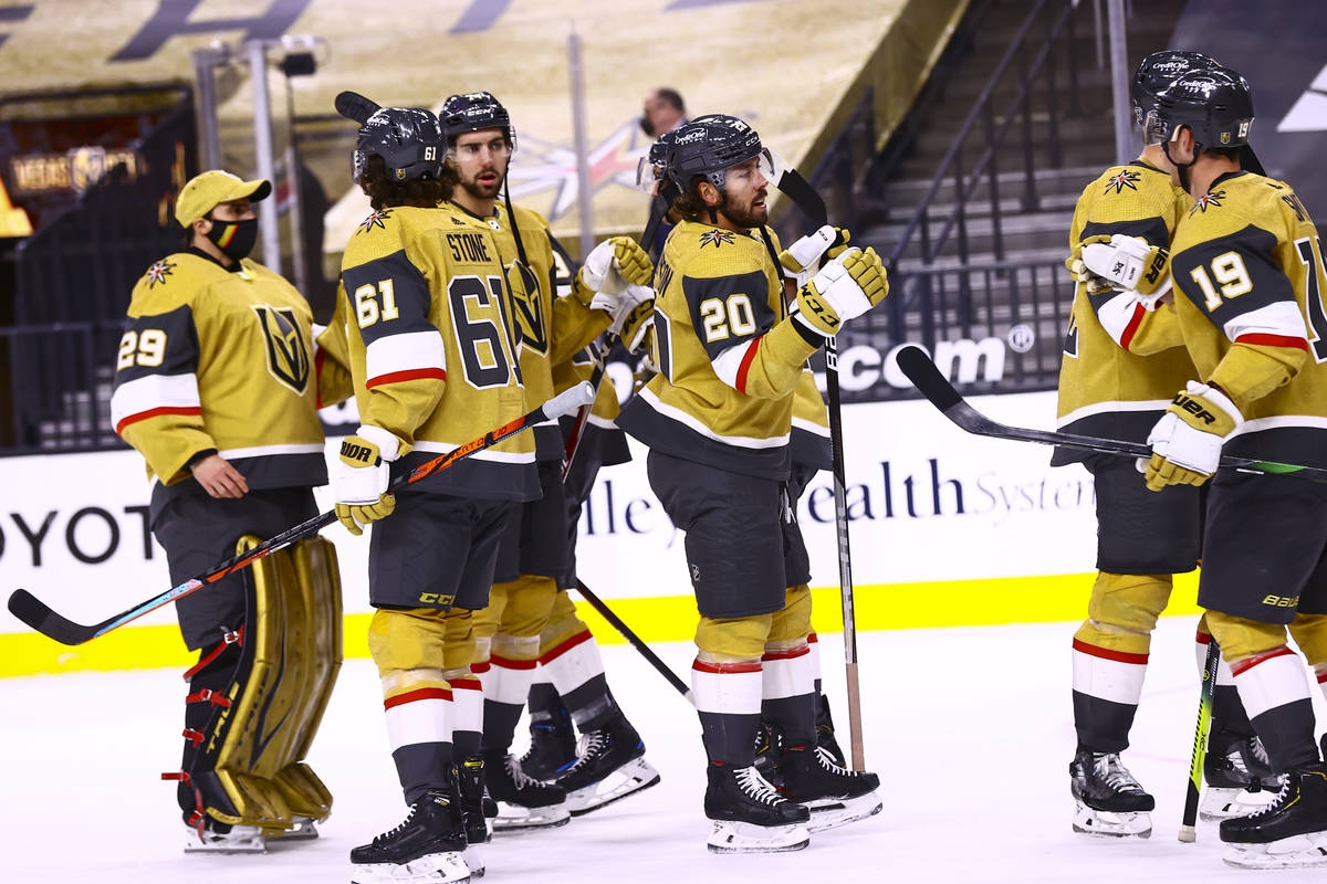 Golden Knights center Chandler Stephenson (20) celebrates with teammates after helping lead the ...