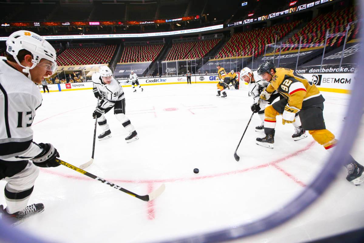 Golden Knights left wing Tomas Nosek (92) chases after the puck against Los Angeles Kings cente ...