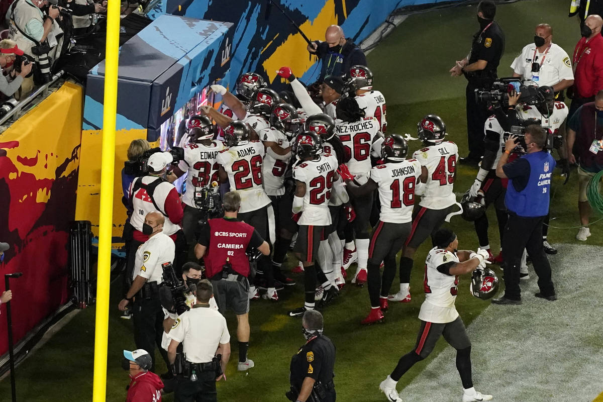 The Tampa Bay Buccaneers defense celebrates an interception during the second half of the NFL S ...