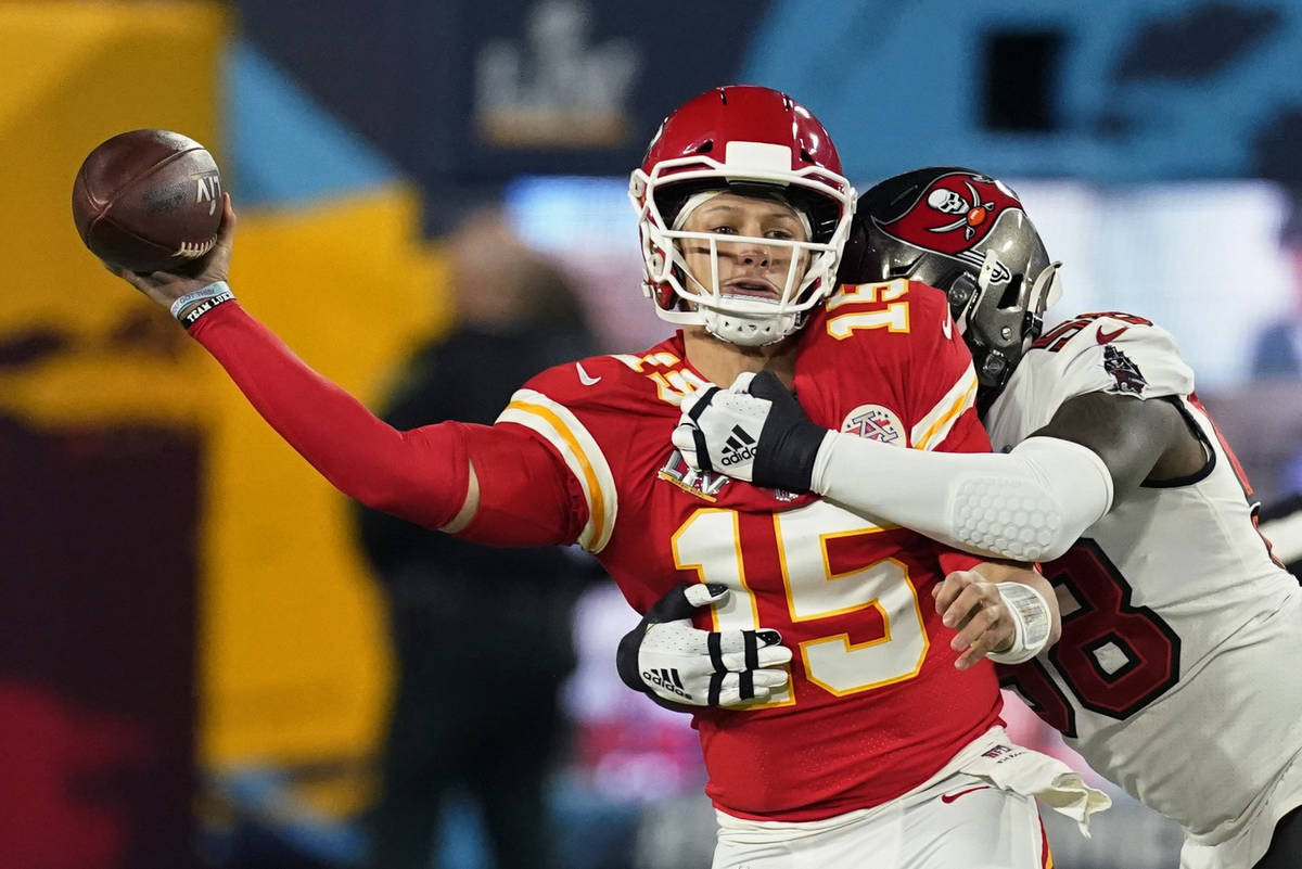 Kansas City Chiefs quarterback Patrick Mahomes passes under pressure from Tampa Bay Buccaneers ...