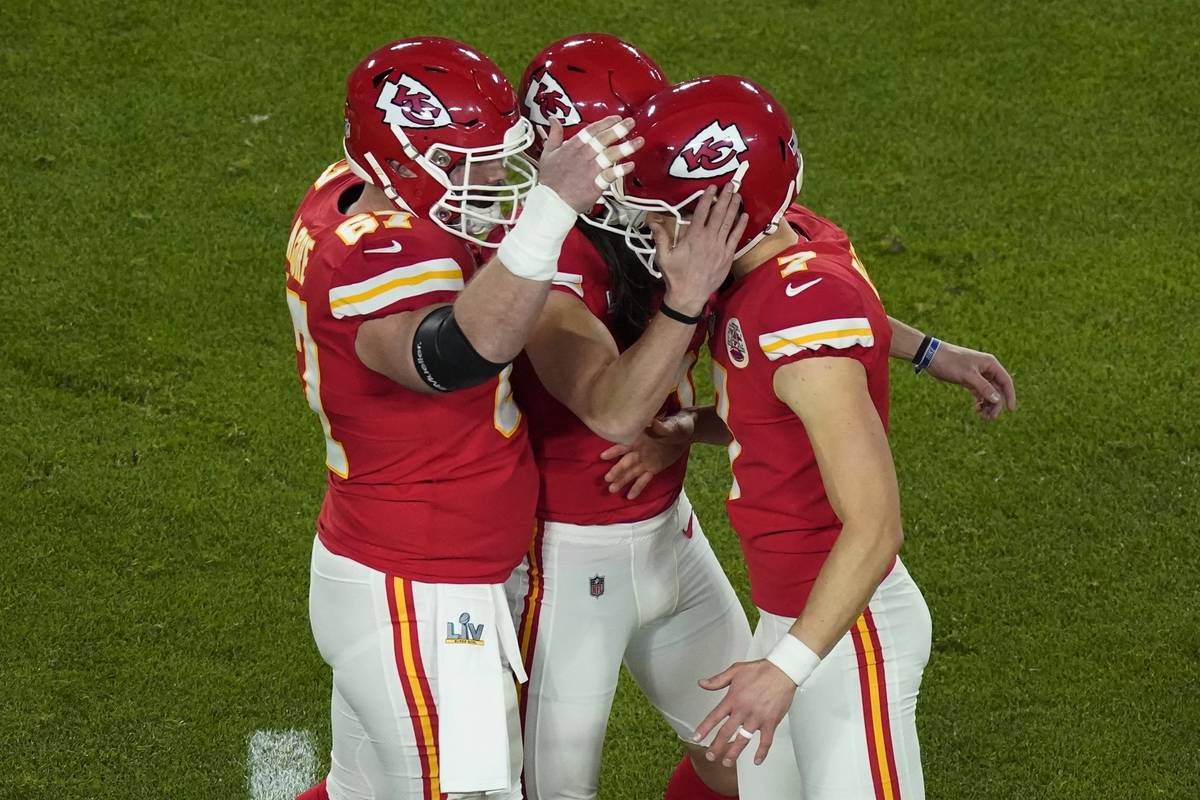 Kansas City Chiefs kicker Harrison Butker (7) is congratulated after kicking a 49-yard field go ...