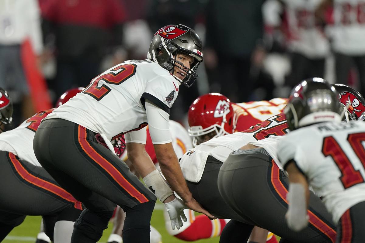 Tampa Bay Buccaneers quarterback Tom Brady takes a snap during the first half of the NFL Super ...