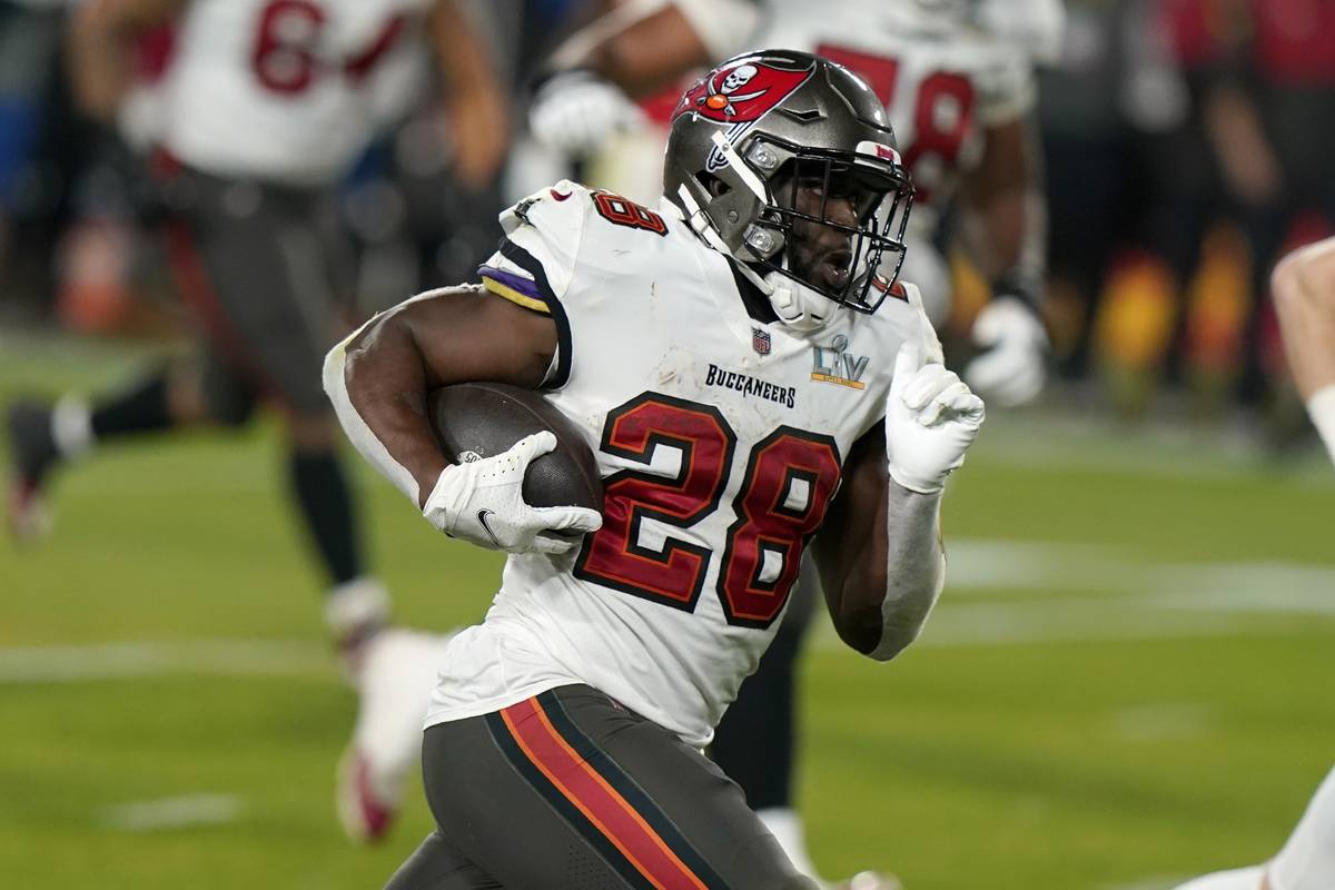 Tampa Bay Buccaneers running back Leonard Fournette sprints to the end zone to score on a 27-ya ...