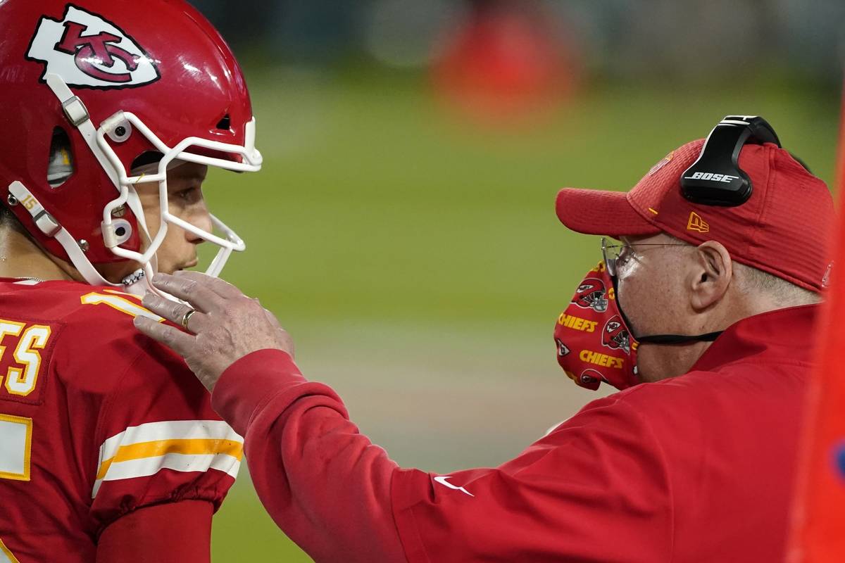 Kansas City Chiefs head coach Andy Reid, right, talks with quarterback Patrick Mahomes during t ...