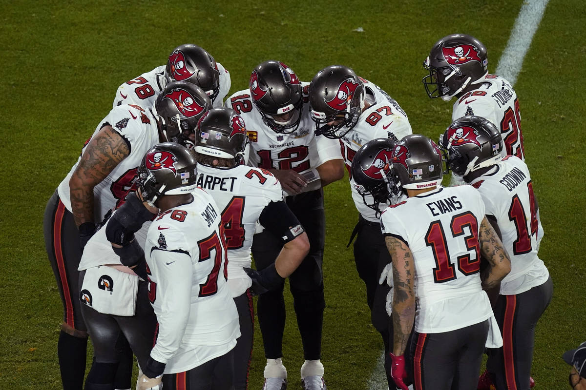 Tampa Bay Buccaneers quarterback Tom Brady celebrates after his team scored a touchdown against ...