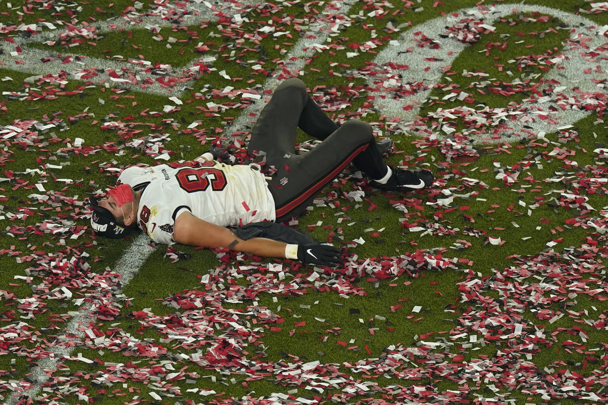 Tampa Bay Buccaneers' Anthony Nelson (98) lies on the field at the end of the NFL Super Bowl 55 ...