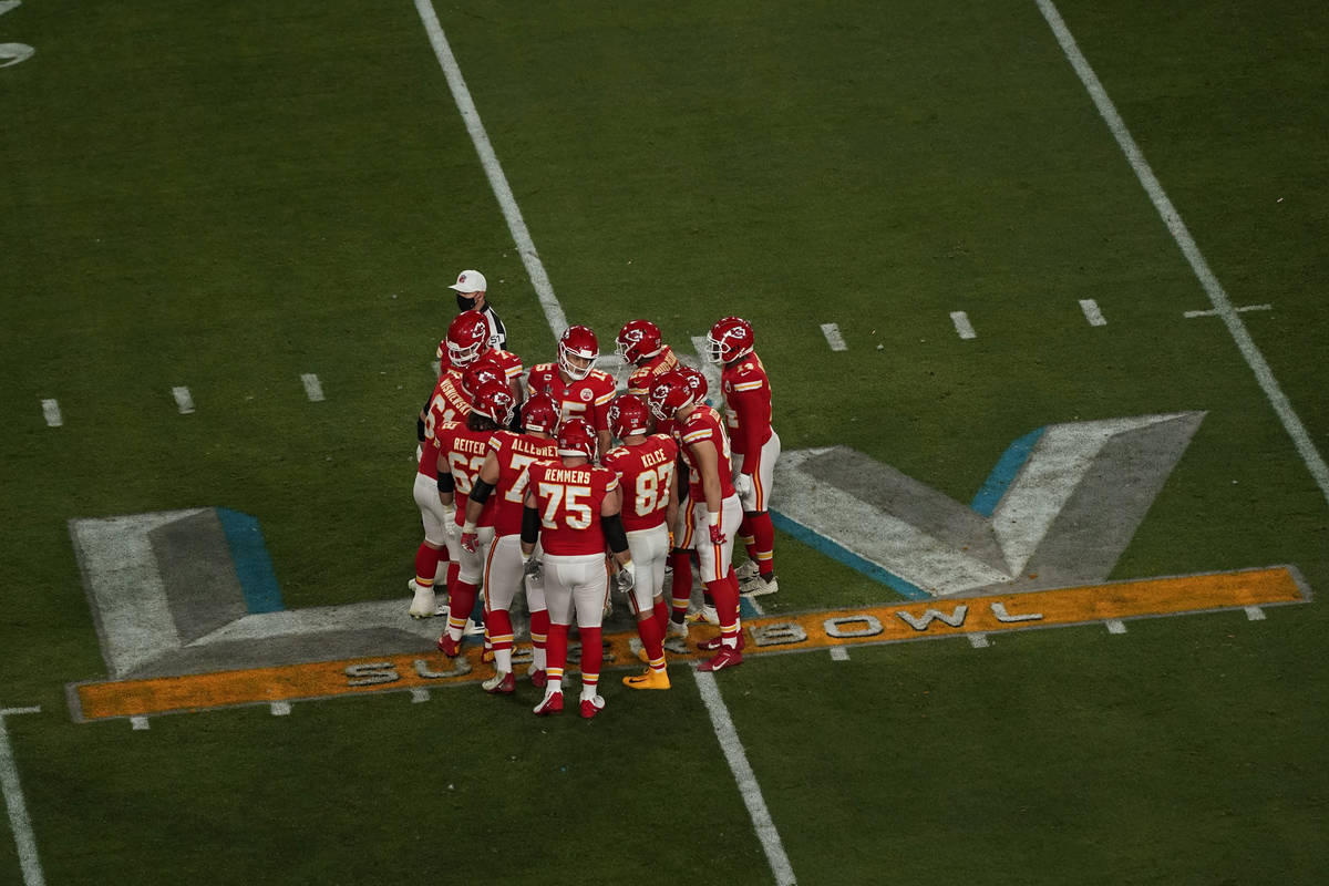 Kansas City Chiefs quarterback Patrick Mahomes (15) goes over a play during the first half of t ...