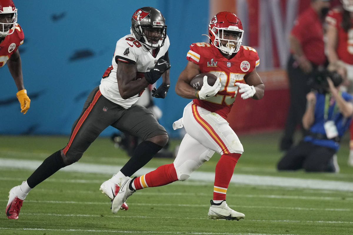 Tampa Bay Buccaneers strong safety Antoine Winfield Jr., holding the ball, celebrates after mak ...