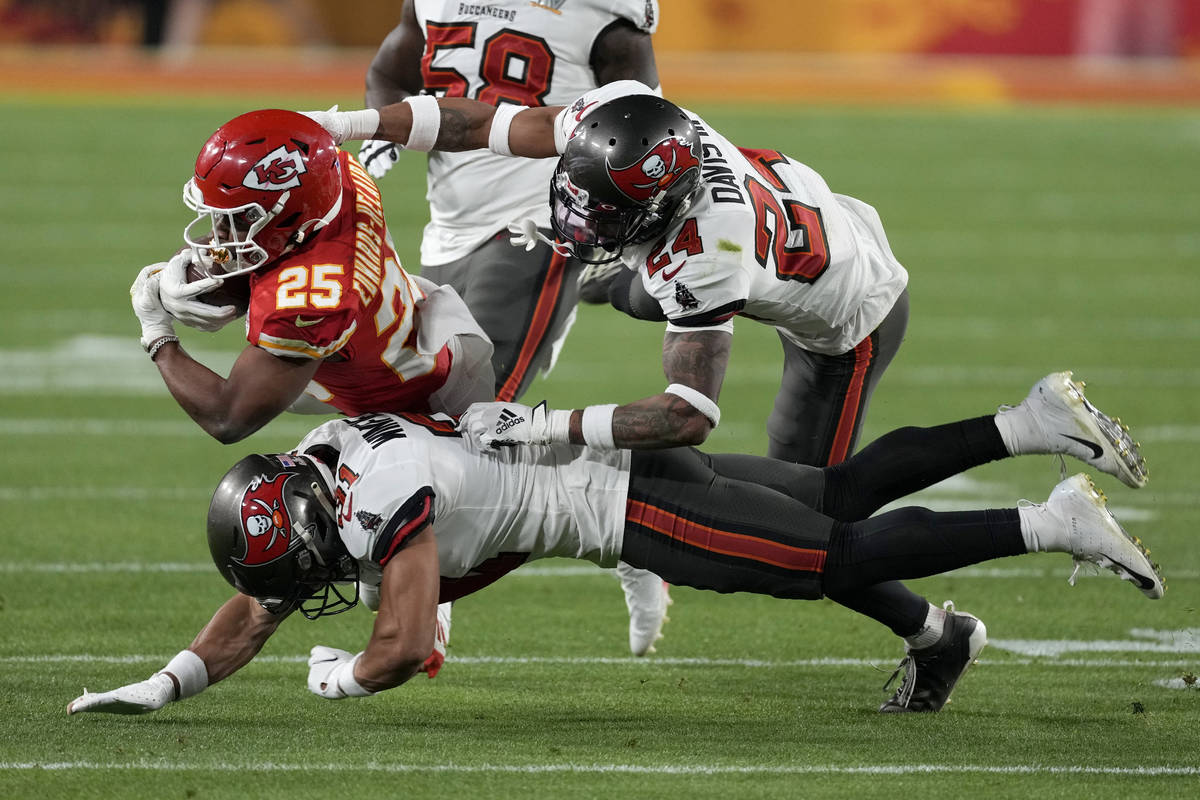 Tampa Bay Buccaneers' Leonard Fournette (28) celebrates a touchdown run with quarterback Tom Br ...