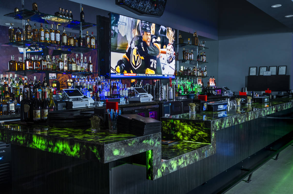 Lighted bar area at the new Diversion Amusements entertainment facility which features a Raider ...
