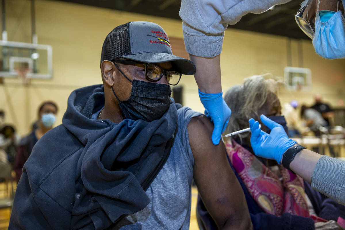 Jay Harris receives a Moderna COVID-19 vaccination at a clinic within the North Charleston Comm ...