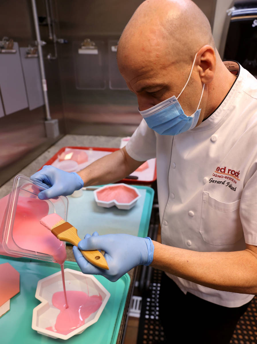Red Rock Resort executive pastry chef Gerard Fabiani makes a large chocolate heart that will be ...