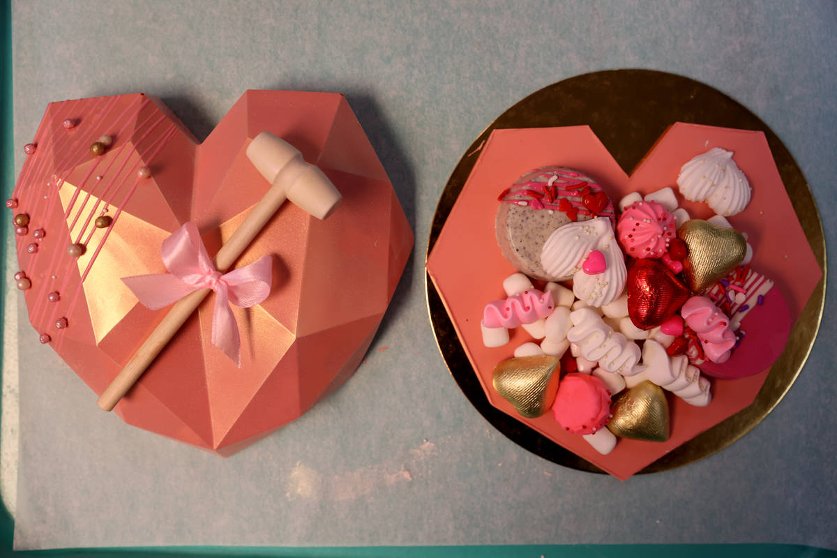 A large chocolate heart is filled with treates to create one of the red Rock Bake Shop's Heartb ...