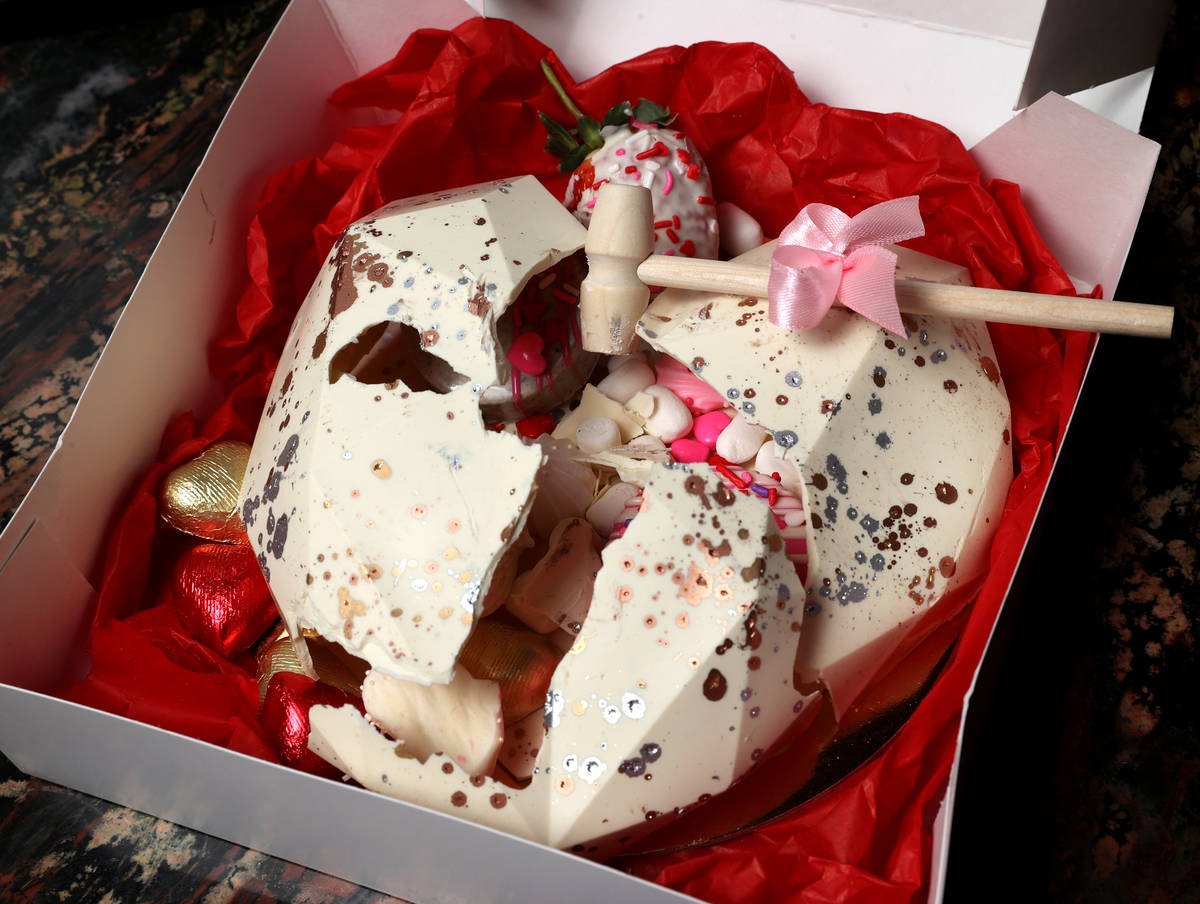 A large white chocolate heart with treats inside, created by Red Rock Resort executive pastry c ...