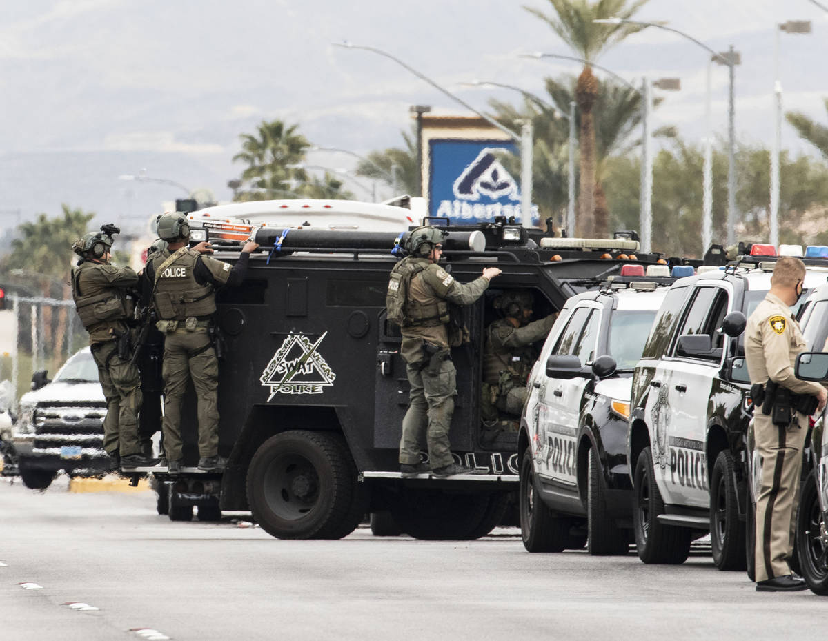 A SWAT team arrive at the scene where The Metropolitan Police Department is investigating a bar ...