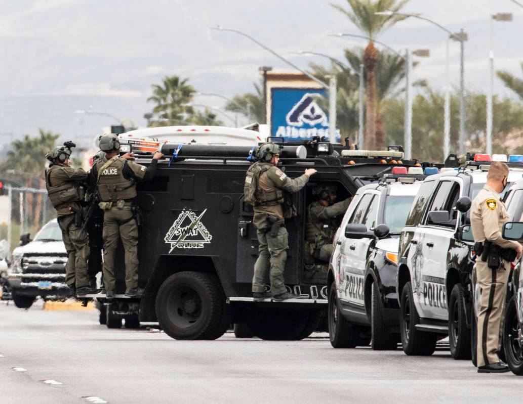 A SWAT team arrive at the scene where The Metropolitan Police Department is investigating a bar ...