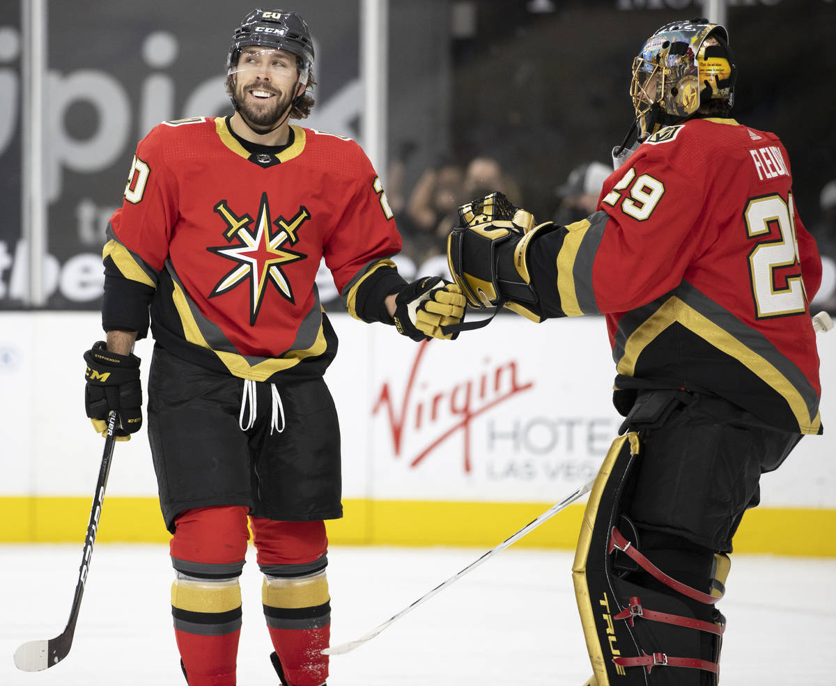 Vegas Golden Knights center Chandler Stephenson (20) celebrates with Vegas Golden Knights goalt ...