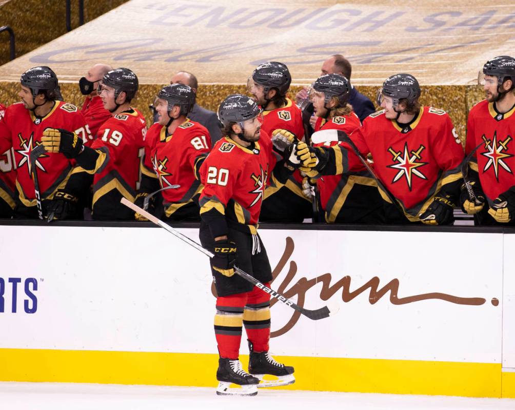 Vegas Golden Knights center Chandler Stephenson (20) celebrates after scoring a goal in the fir ...