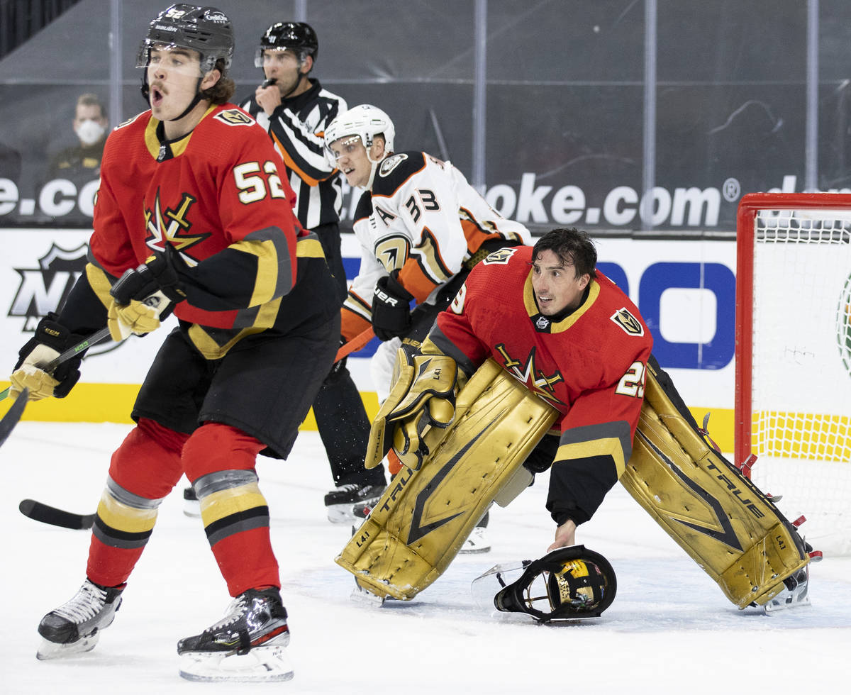 Vegas Golden Knights goaltender Marc-Andre Fleury (29) defends the net after his mask came off ...