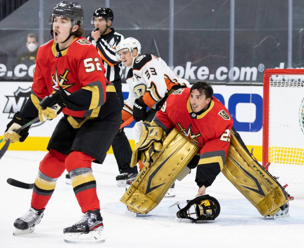 Vegas Golden Knights goaltender Marc-Andre Fleury (29) defends the net after his mask came off ...