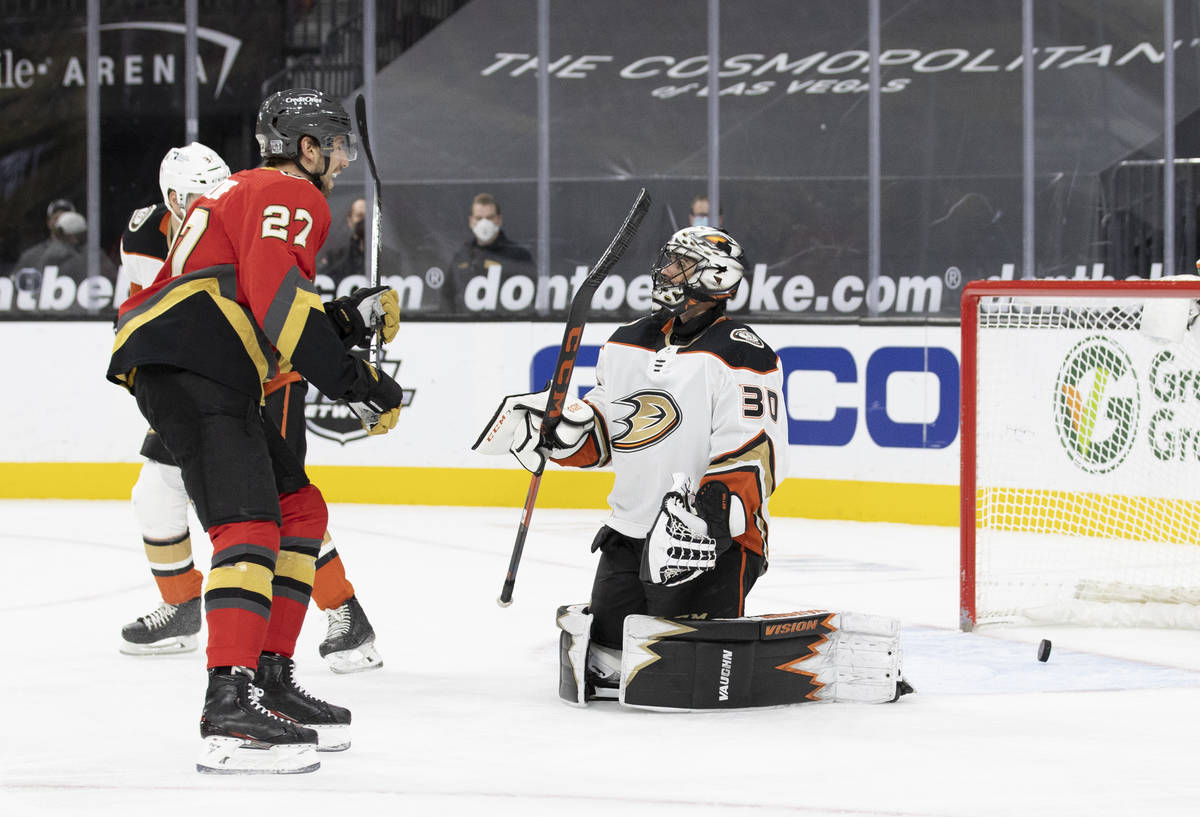 Vegas Golden Knights defenseman Shea Theodore (27) celebrates after the Knights scored a goal a ...