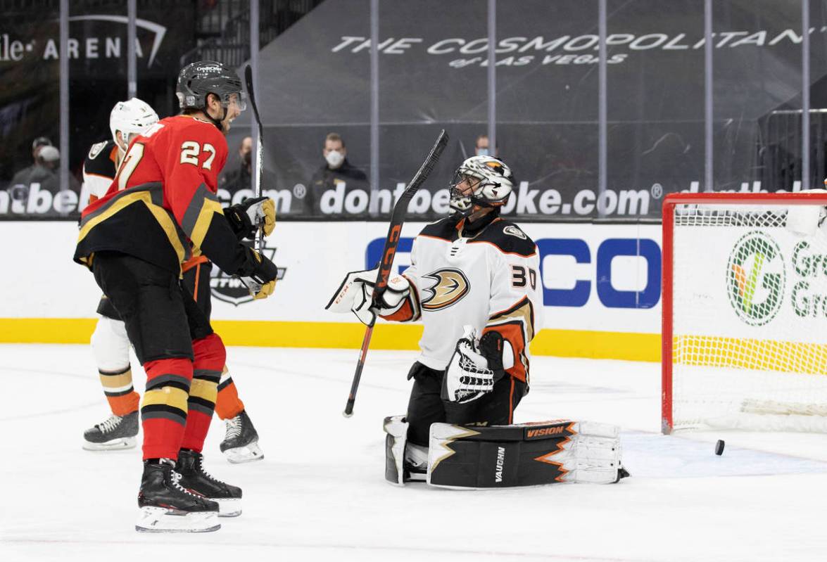 Vegas Golden Knights defenseman Shea Theodore (27) celebrates after the Knights scored a goal a ...