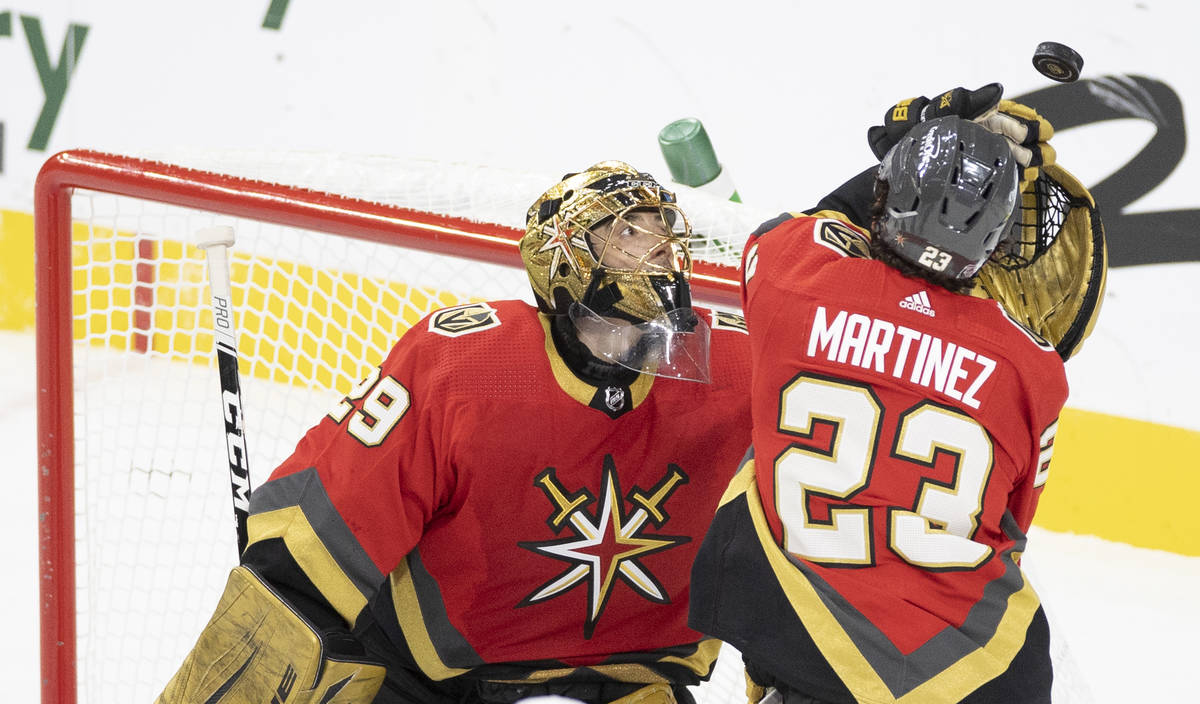 Vegas Golden Knights goaltender Marc-Andre Fleury (29) makes a save with the help of Vegas Gold ...