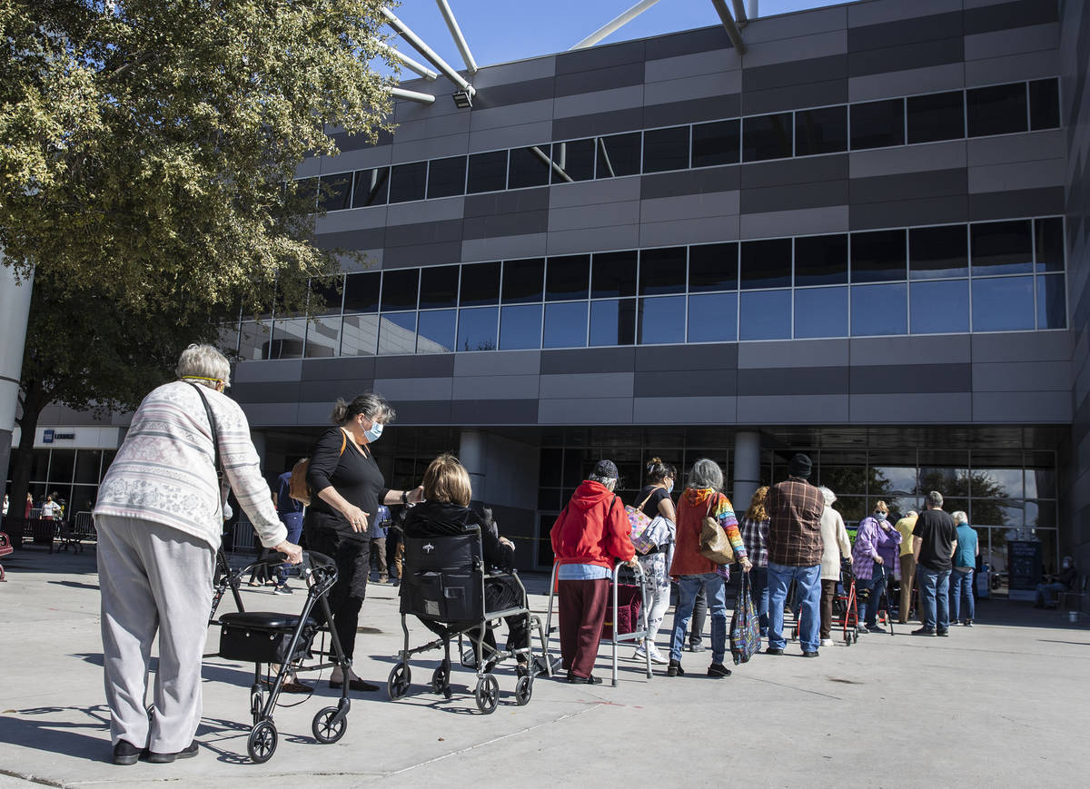 People lined up to get their second doses of vaccine at the Las Vegas Convention Center's vacci ...