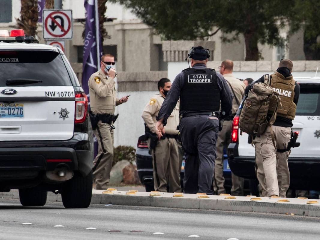 Police investigate a barricade situation at Milan Apartment Townhomes on East Silverado Ranch B ...