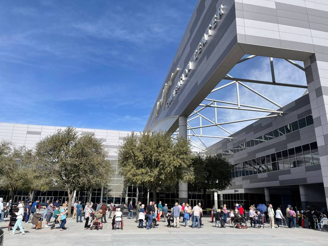 People line up for the second dose of the COVID-19 vaccine outside the Las Vegas Convention Cen ...