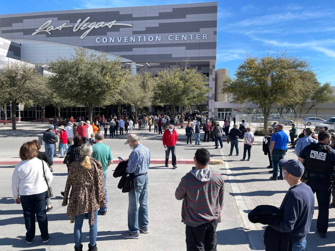 People line up for the second dose of the COVID-19 vaccine outside the Las Vegas Convention Cen ...