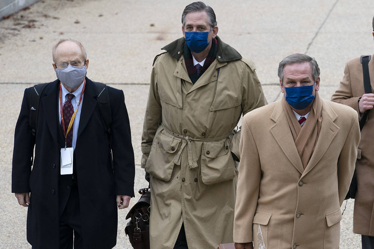 From left, David Schoen, Bruce Castor and Michael van der Veen, lawyers for former President Do ...