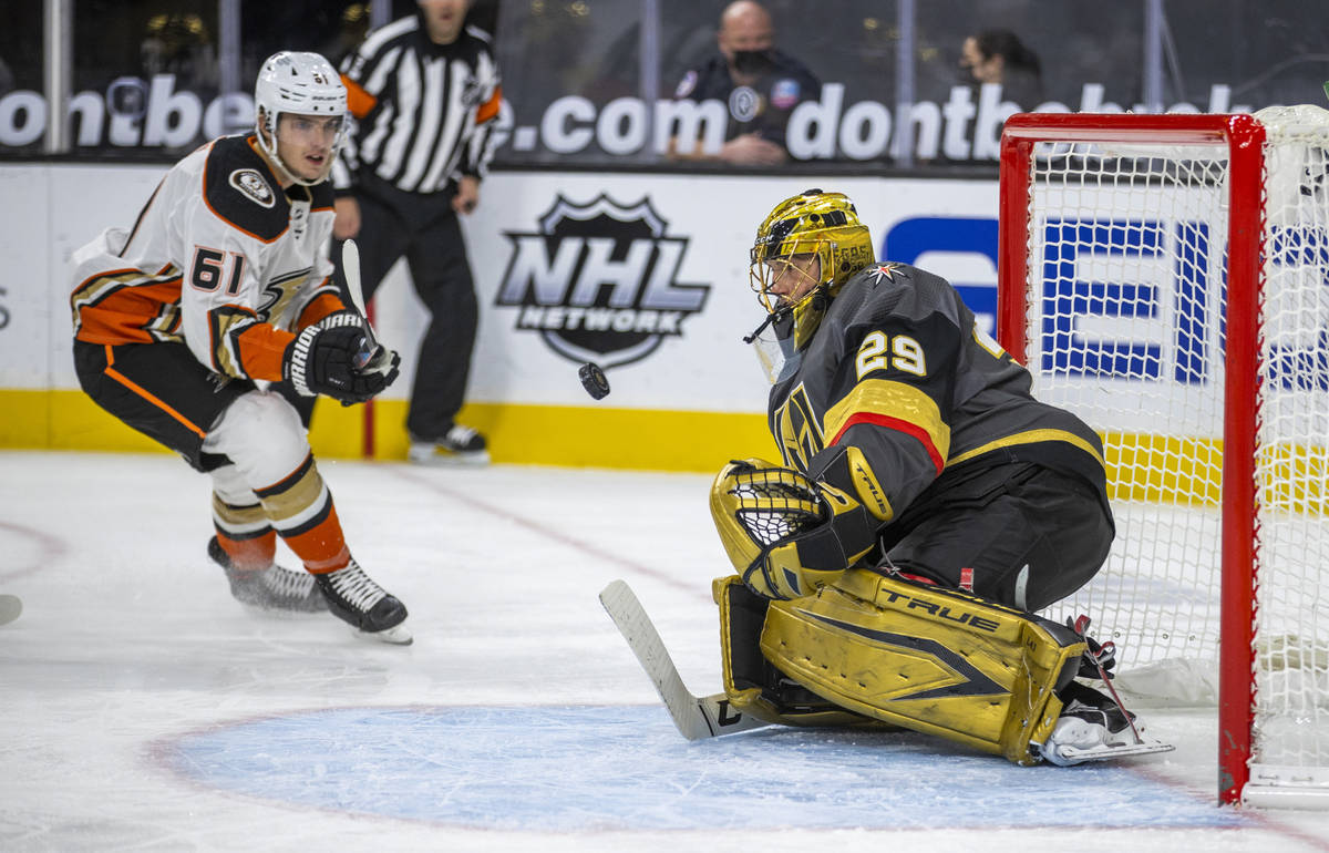 Golden Knights goaltender Marc-Andre Fleury (29) eyes a shot on goal by Anaheim Ducks center Tr ...