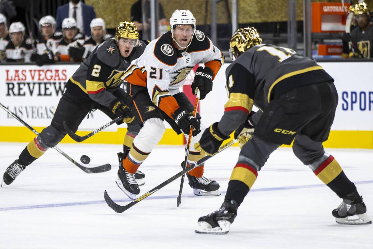 Anaheim Ducks right wing David Backes (21) has the puck slapped away by Golden Knights defensem ...