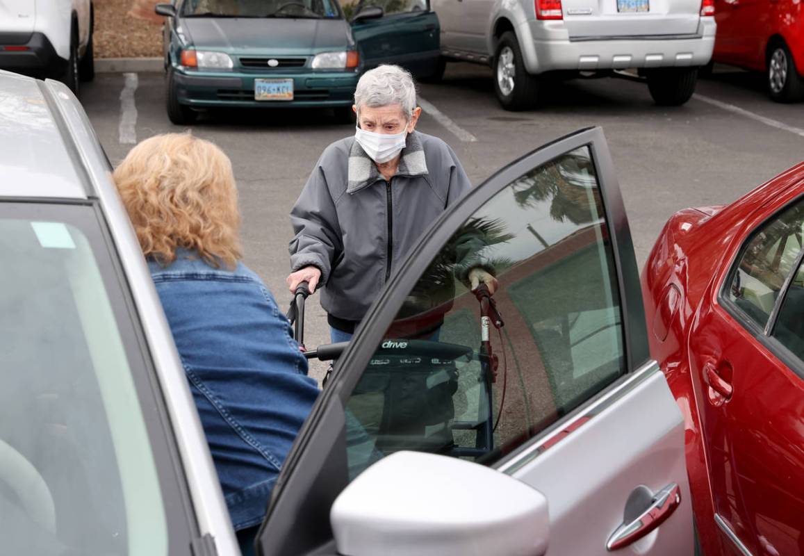 Estelle Roberts, 92, right, gets help from her daughter Dori Roberts-Lombardi, 65, after a doct ...