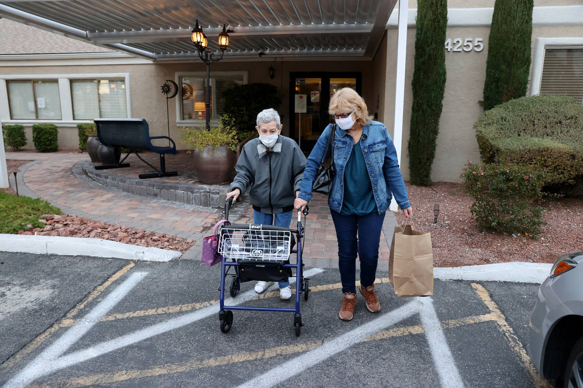 Estelle Roberts, 92, left, and her daughter Dori Roberts-Lombardi, 65, at her Las Vegas assiste ...