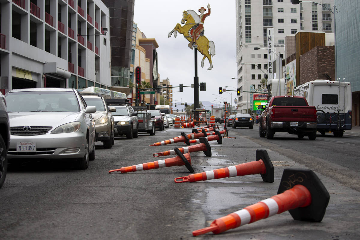 Traffic cones are blown over on Las Vegas Boulevard after Clark County issued a severe thunders ...