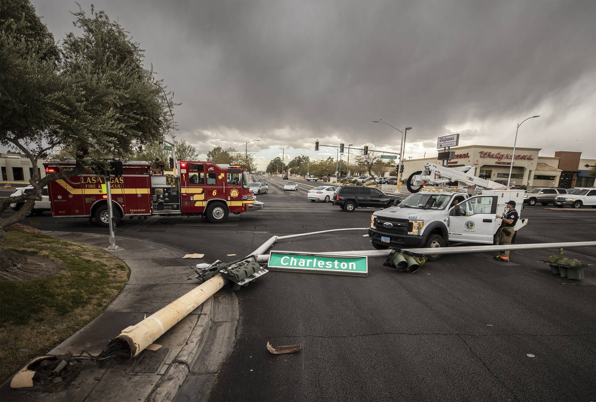 Heavy winds knocked down a power line at the intersection of West Charleston Boulevard and Sout ...