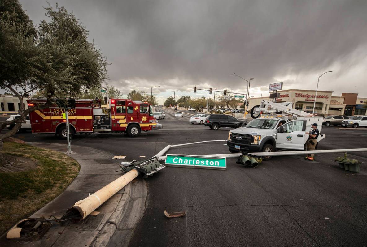 Heavy winds knocked down a power line at the intersection of West Charleston Boulevard and Sout ...