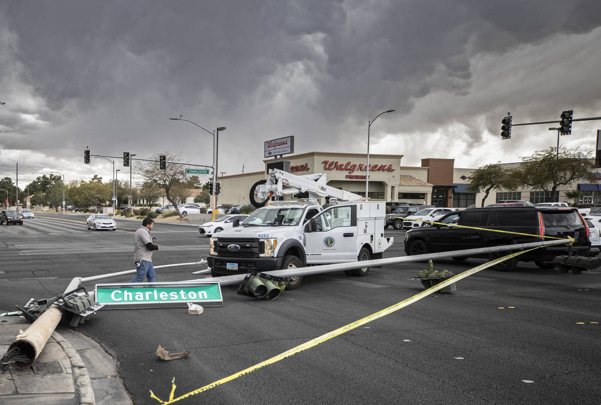 Heavy winds knocked down a power line at the intersection of West Charleston Boulevard and Sout ...