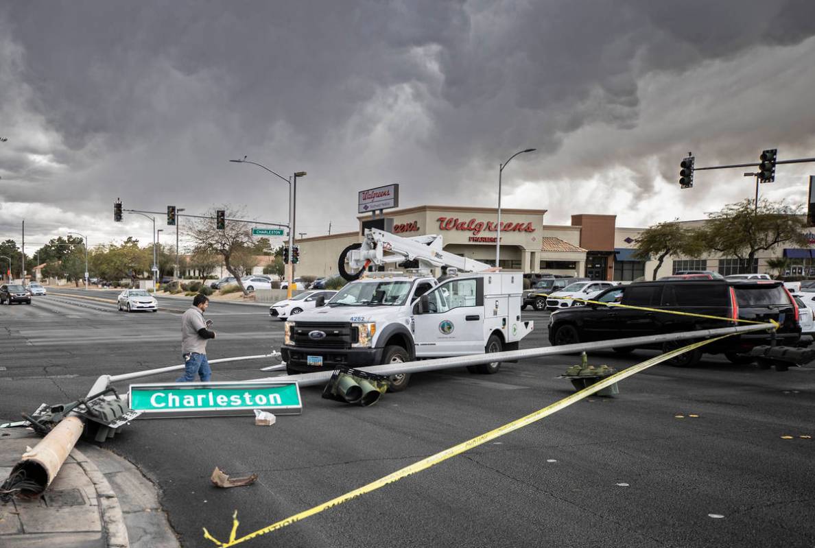 Heavy winds knocked down a power line at the intersection of West Charleston Boulevard and Sout ...