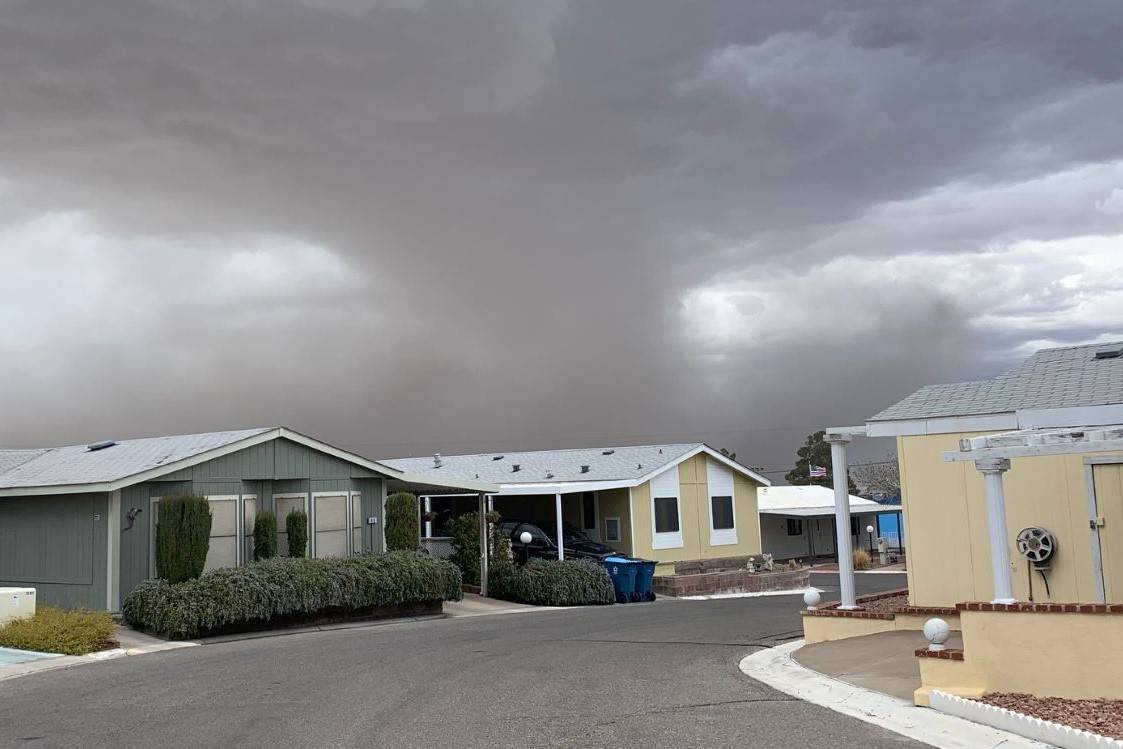 Clouds move over the houses near Boulder Highway and Greenway Road in Henderson, Saturday, Feb. ...