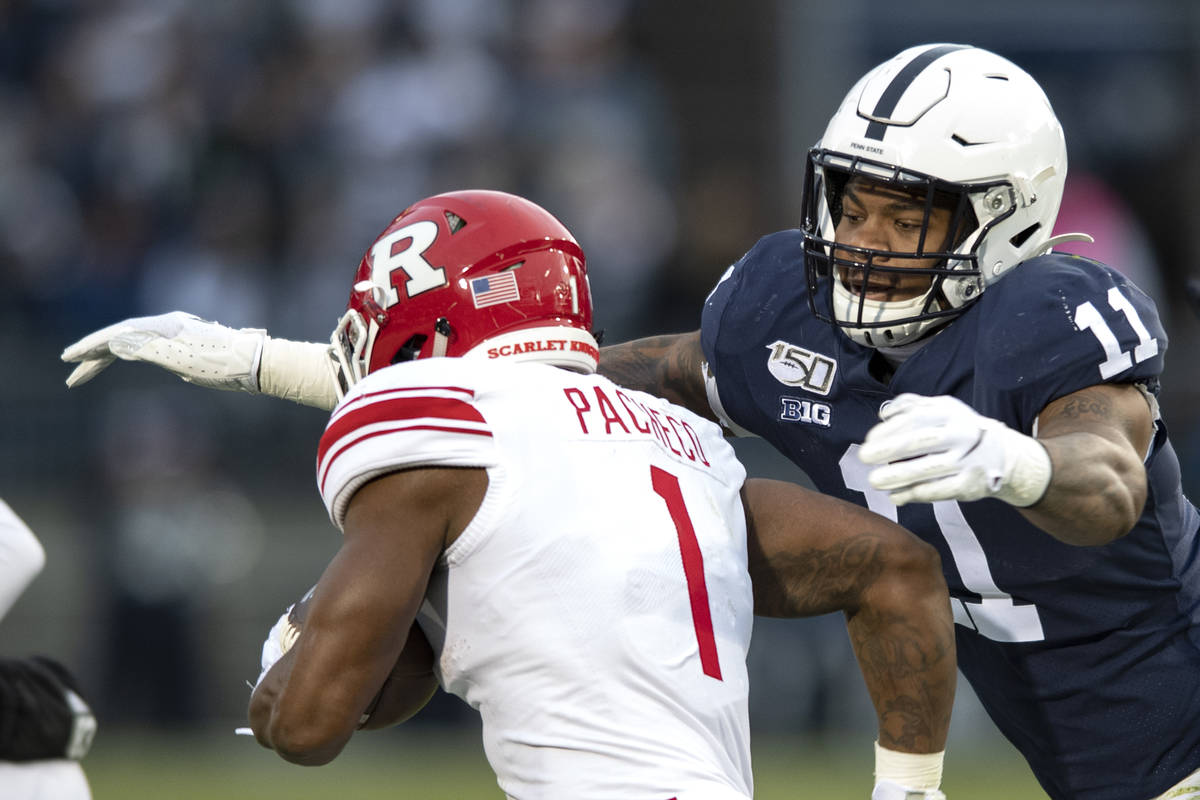 Penn State linebacker Micah Parsons (11) tackles Rutgers running back Isaih Pacheco during an N ...